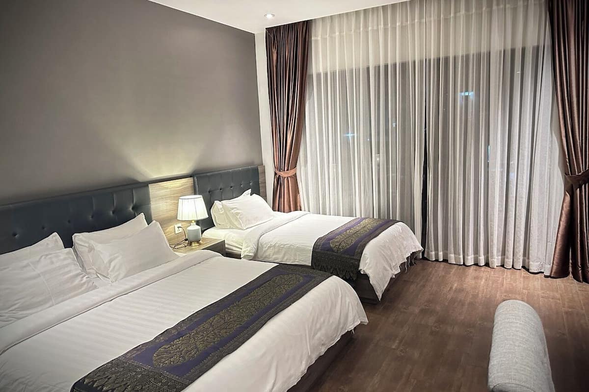 Family Room | Premium bedding, minibar, in-room safe, desk