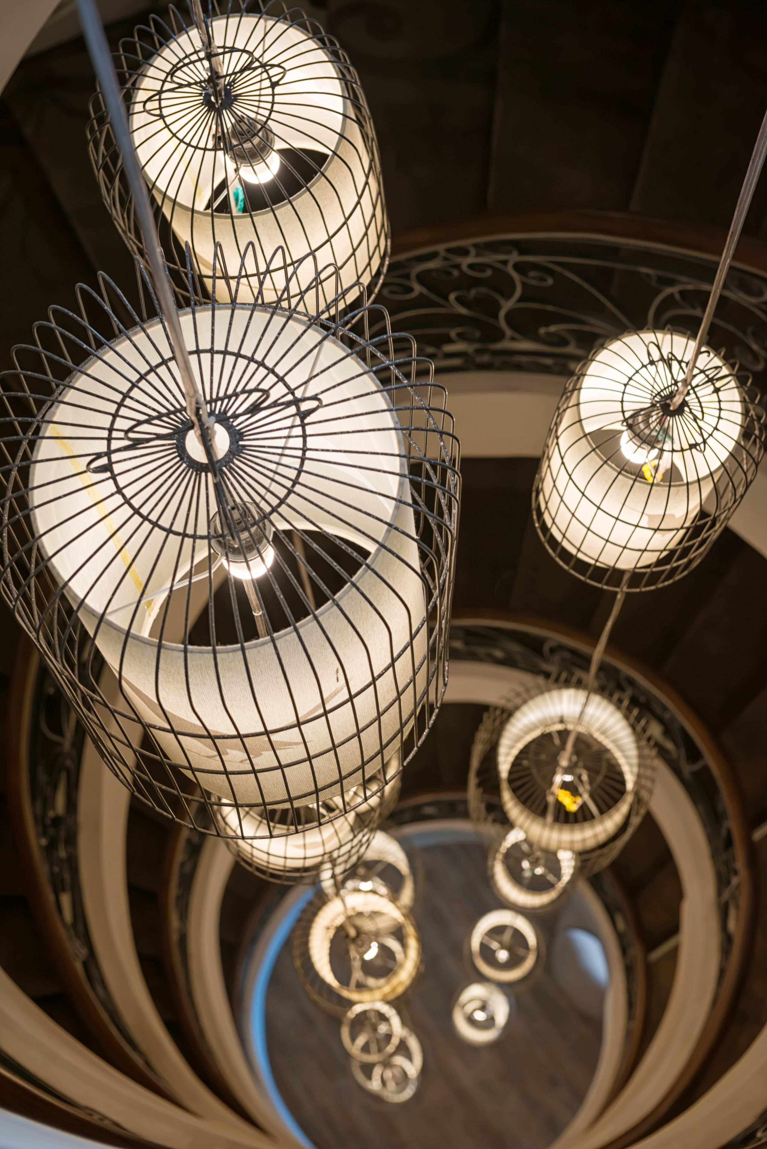A spiral staircase with a modern design, featuring a series of circular platforms and a central column.