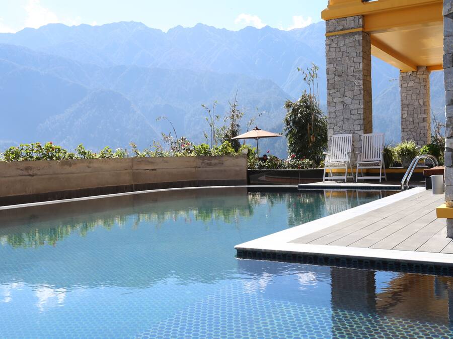 Outdoor pool, pool umbrellas, sun loungers