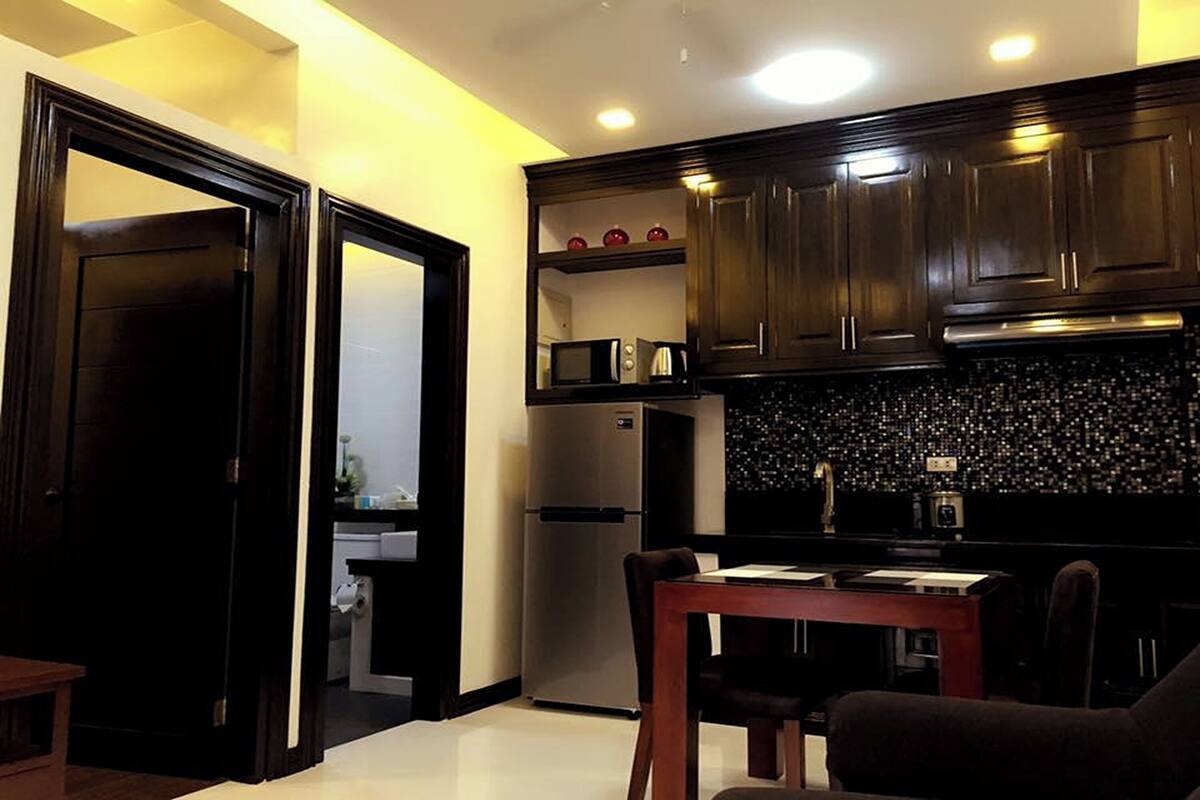 condo suite room | private kitchen | coffee/tea maker, electric kettle