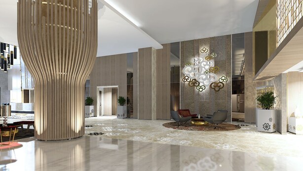 A spacious lobby with a modern design, featuring a central column, seating area, and decorative wall panels. - The Excelton Hotel (Palembang)