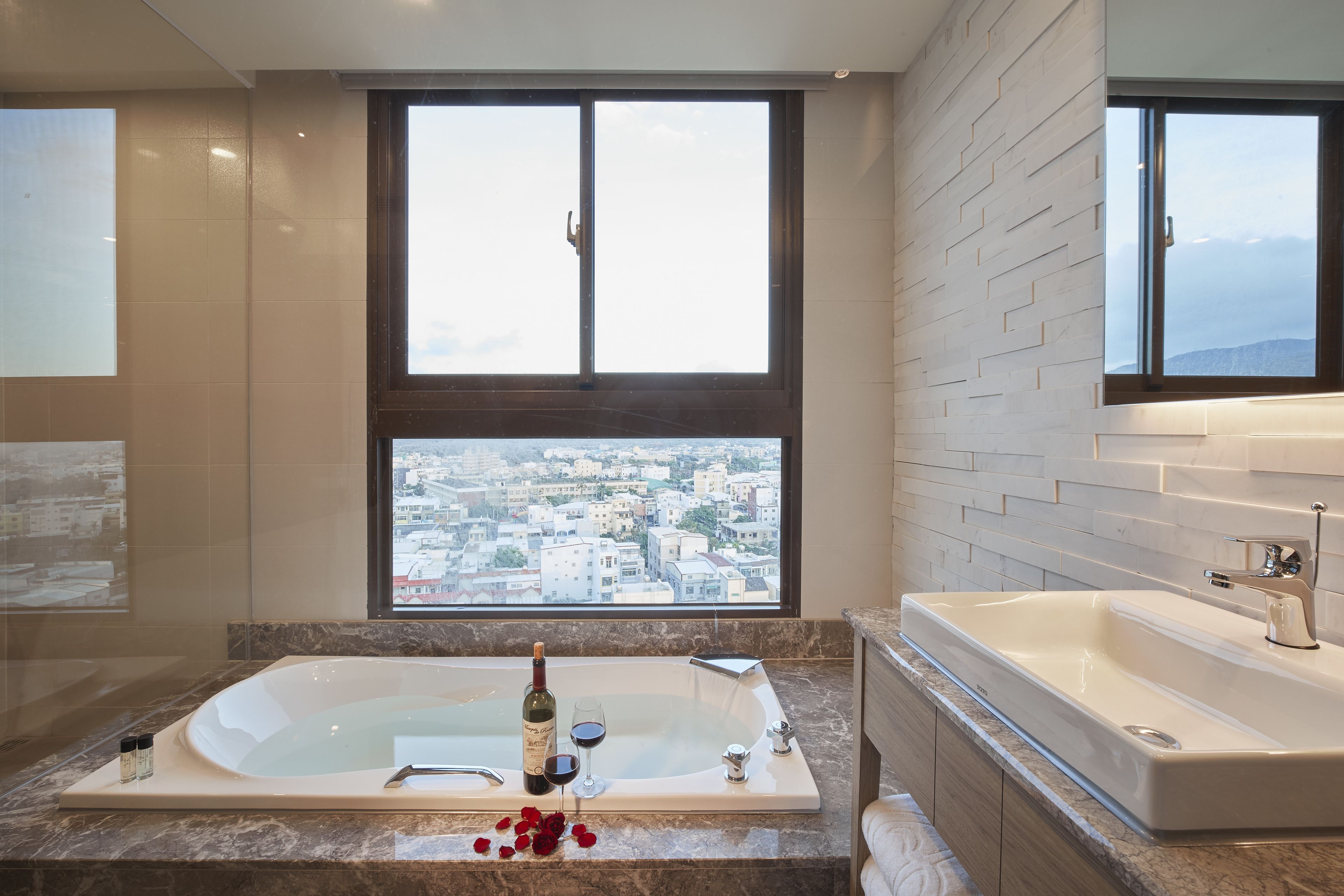 deluxe honeymoon suite | bathroom | separate bathtub and shower, hair dryer, towels