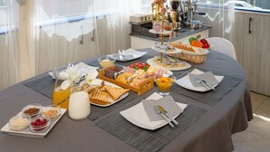 A breakfast buffet with various food items and a coffee station. - Anastasia Suites Zagreb (Zagreb)