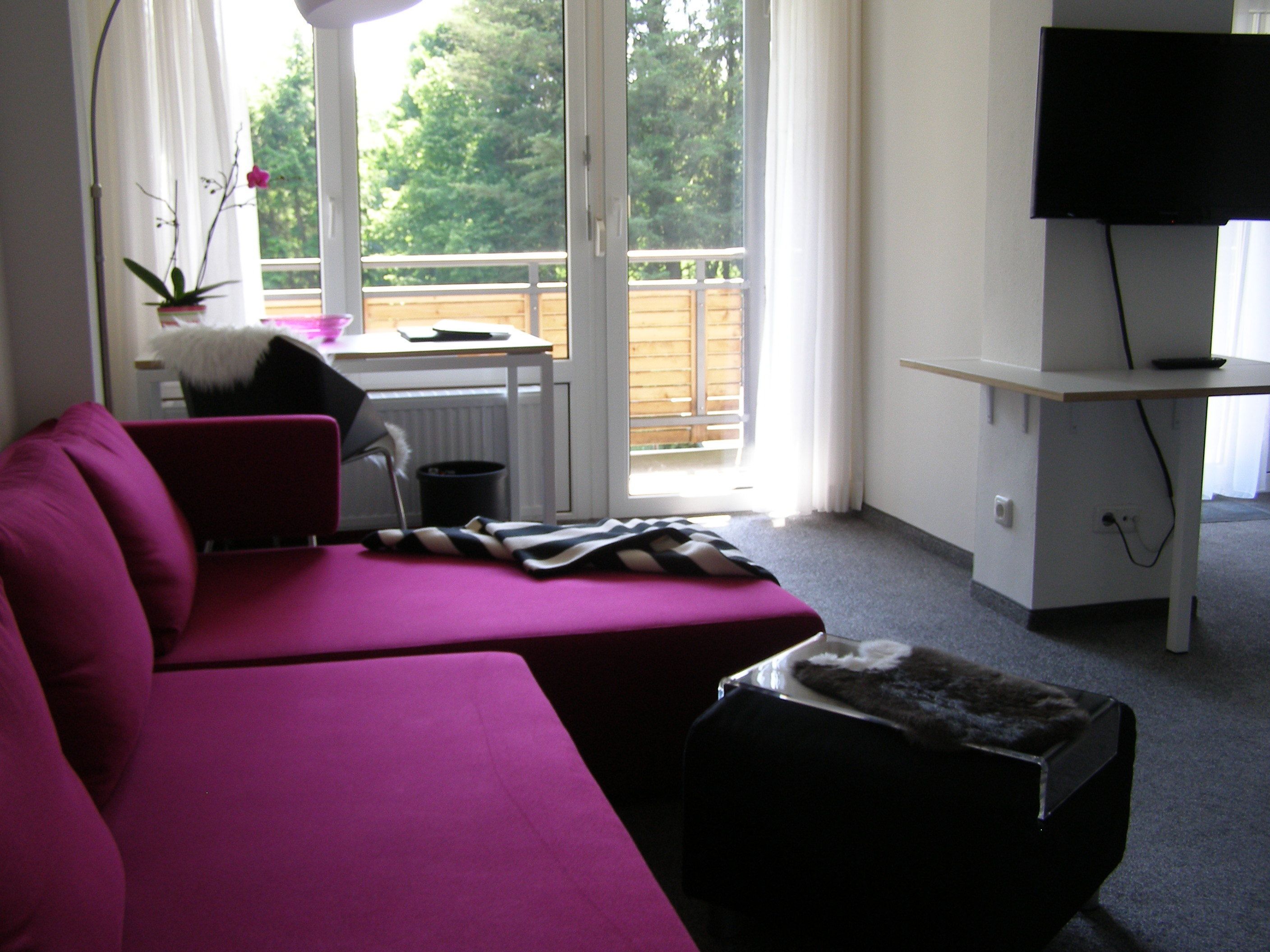 junior suite, balcony, garden view | living area | lcd tv