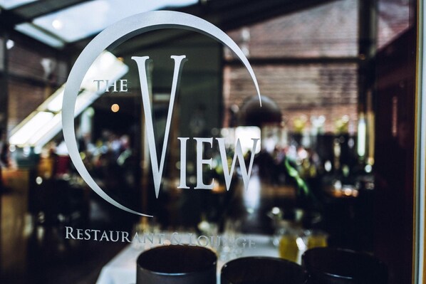 A restaurant sign with the name "The View" and mentions it is a restaurant and lounge. - THEhotel at LIPPISCHER HOF (Bad Salzuflen)