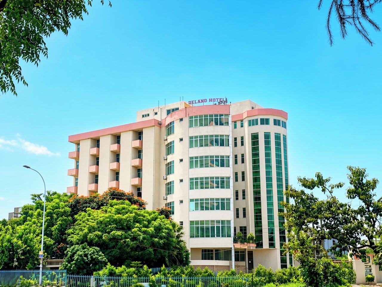 A multi-story hotel with a prominent sign reading 'DELANO HOTEL'.