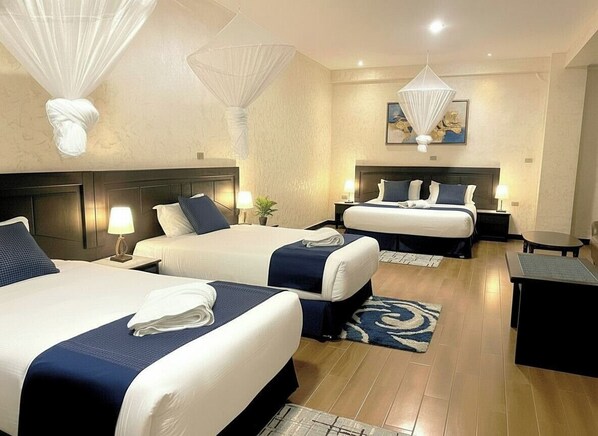Family Triple Room, Mobility Accessible, City View | Memory foam beds, free minibar, in-room safe, desk