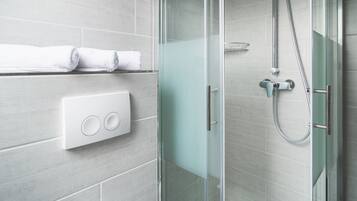 Shower, rainfall showerhead, hair dryer, towels