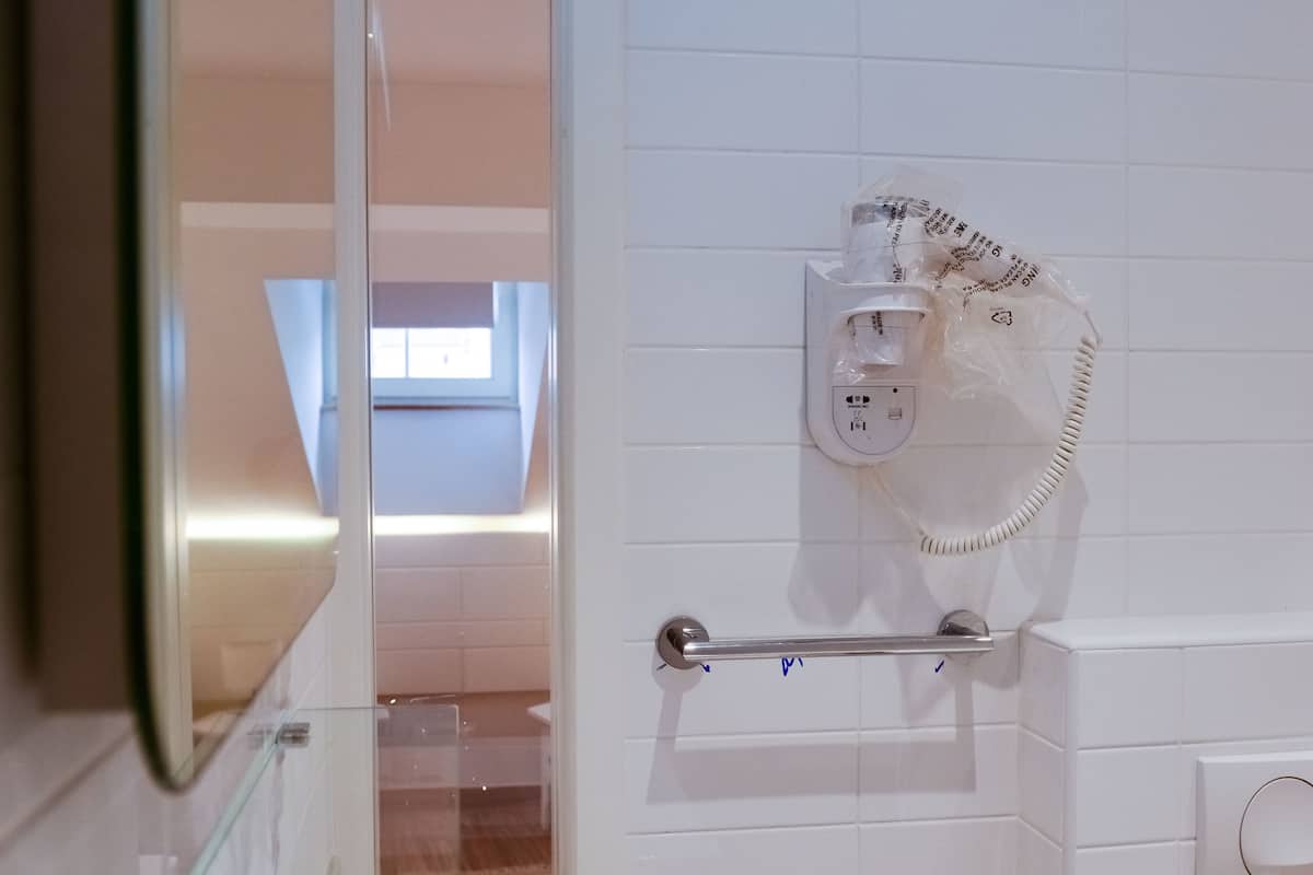 superior twin room | bathroom | shower, free toiletries, hair dryer, slippers