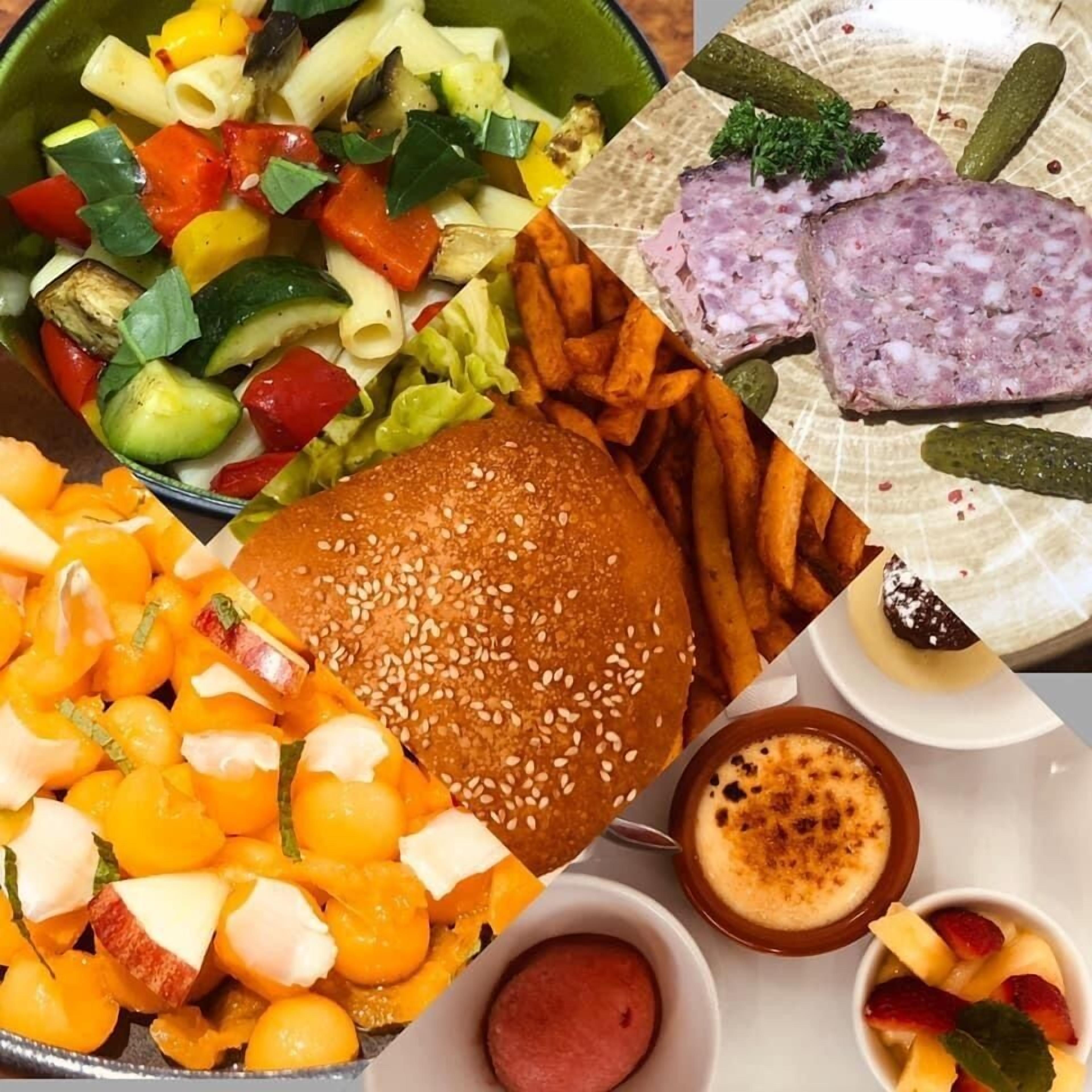A meal with a burger, fries, salad, and various side dishes.