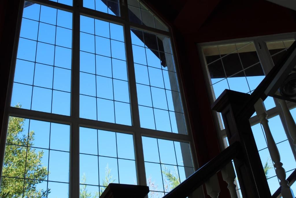 A large window with a grid pattern, part of a building's interior structure.
