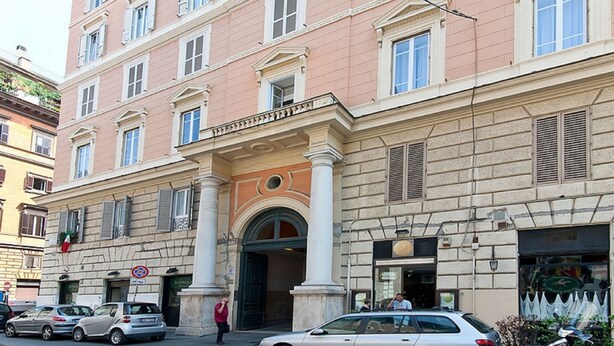 A multi-story building with a classical architectural style, featuring columns and a central entrance. - AmoRoma (Rome)