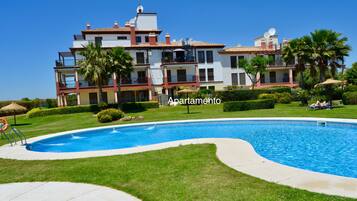8 outdoor pools, an infinity pool, pool umbrellas, pool loungers