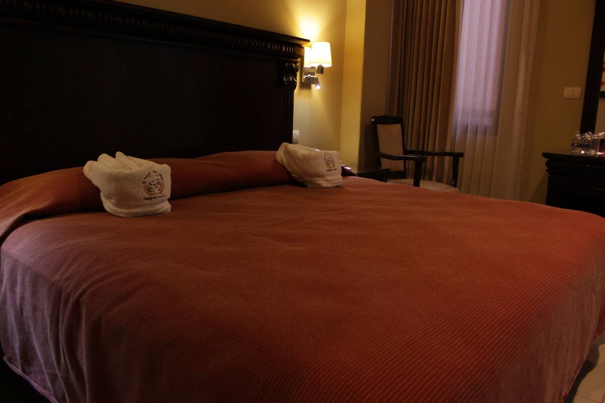 Suite, 1 King Bed | In-room safe, desk, iron/ironing board (on request), free WiFi
