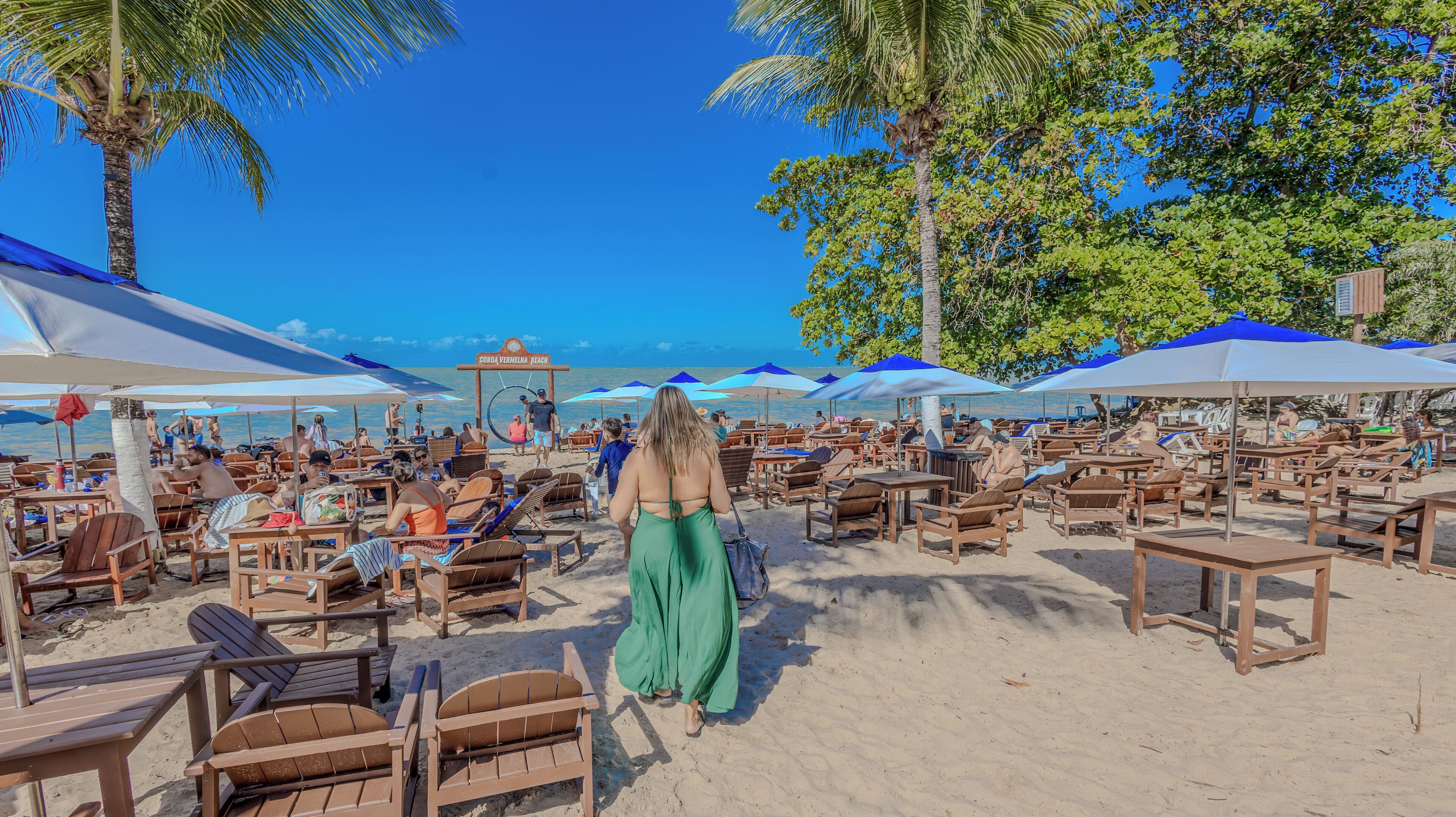 On the beach, white sand, sun loungers, beach umbrellas