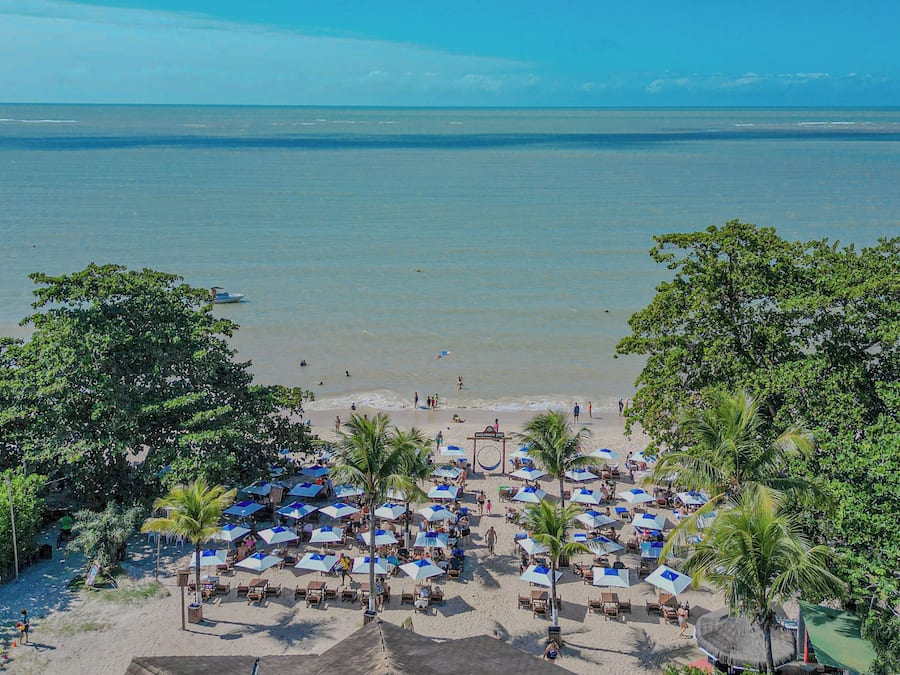 On the beach, white sand, sun loungers, beach umbrellas