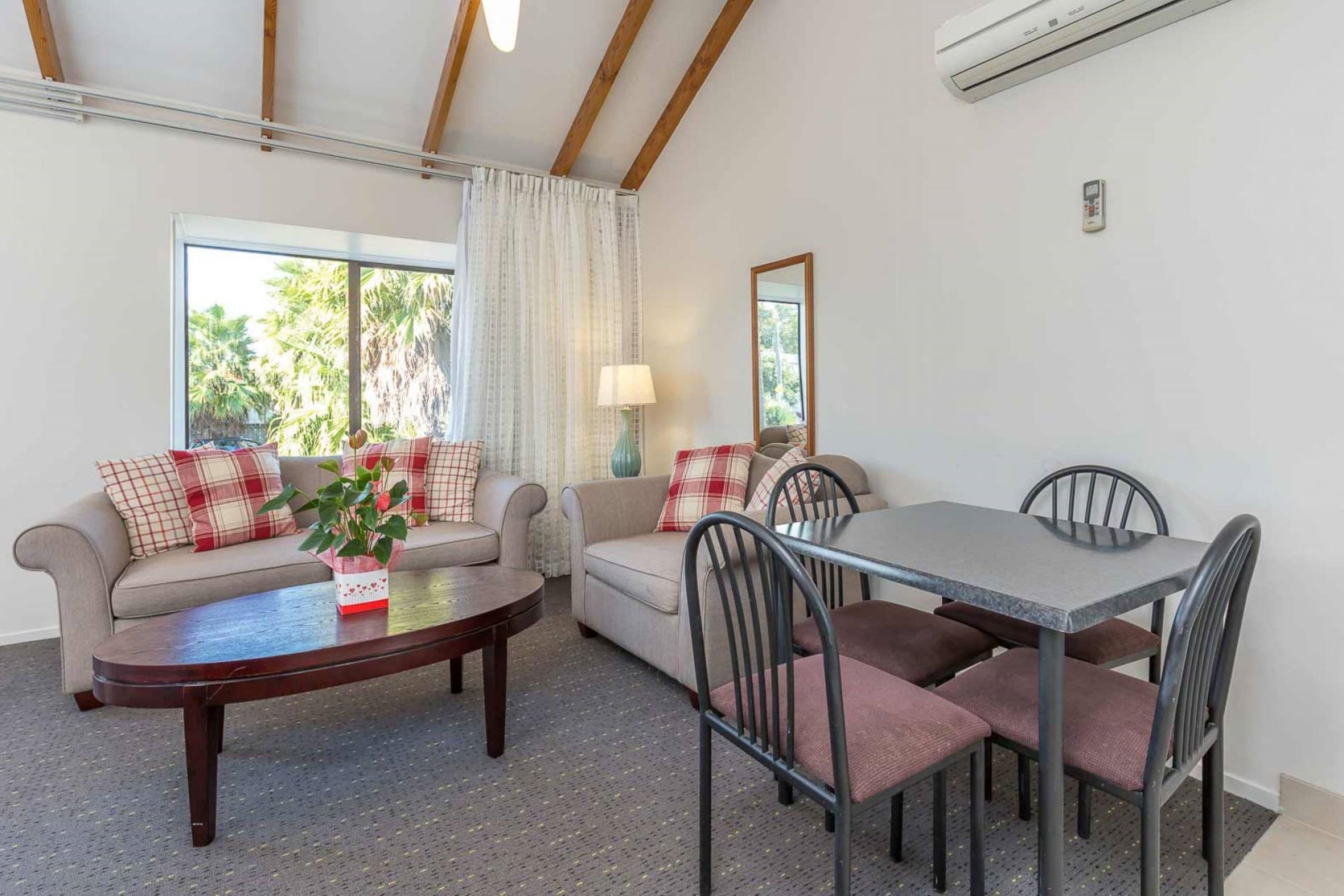 One Bedroom Apartment (1st Floor) | Living area | 50-inch flat-screen TV with satellite channels, TV, Netflix