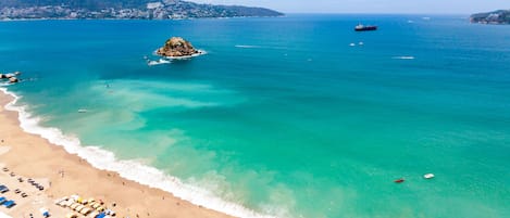 Beach umbrellas, beach towels, beach volleyball