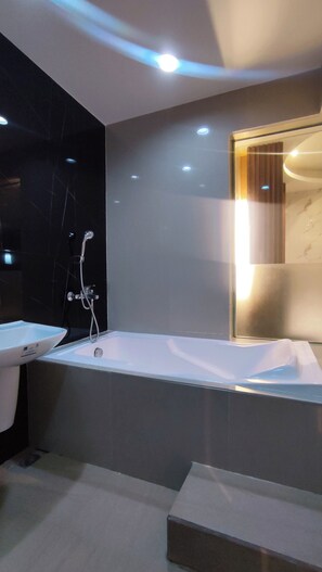Superior Room | Bathroom | Free toiletries, hair dryer, bathrobes, slippers - One Serenata Hotel Bacoor (Bacoor City)