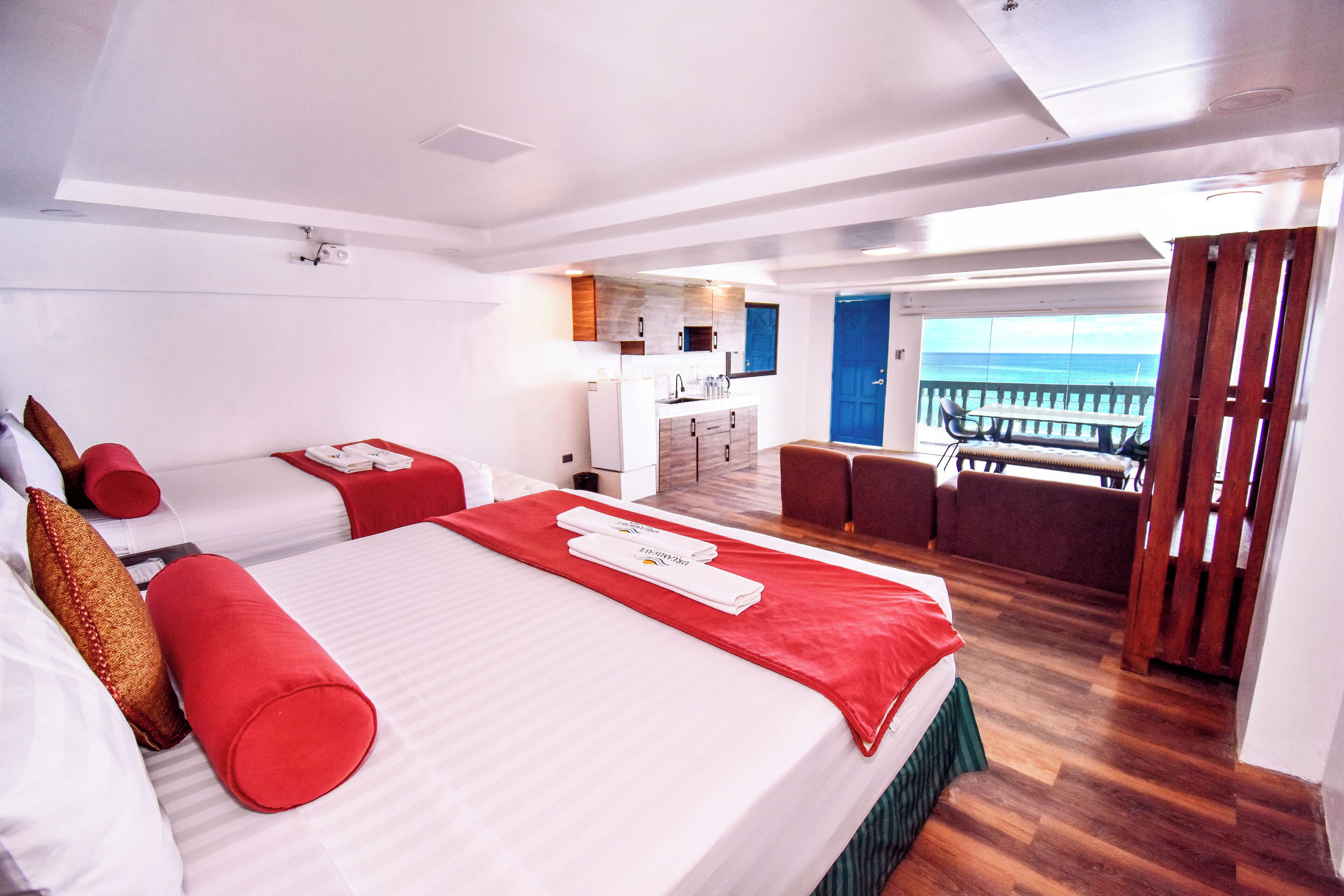 Desk, iron/ironing board, bed sheets