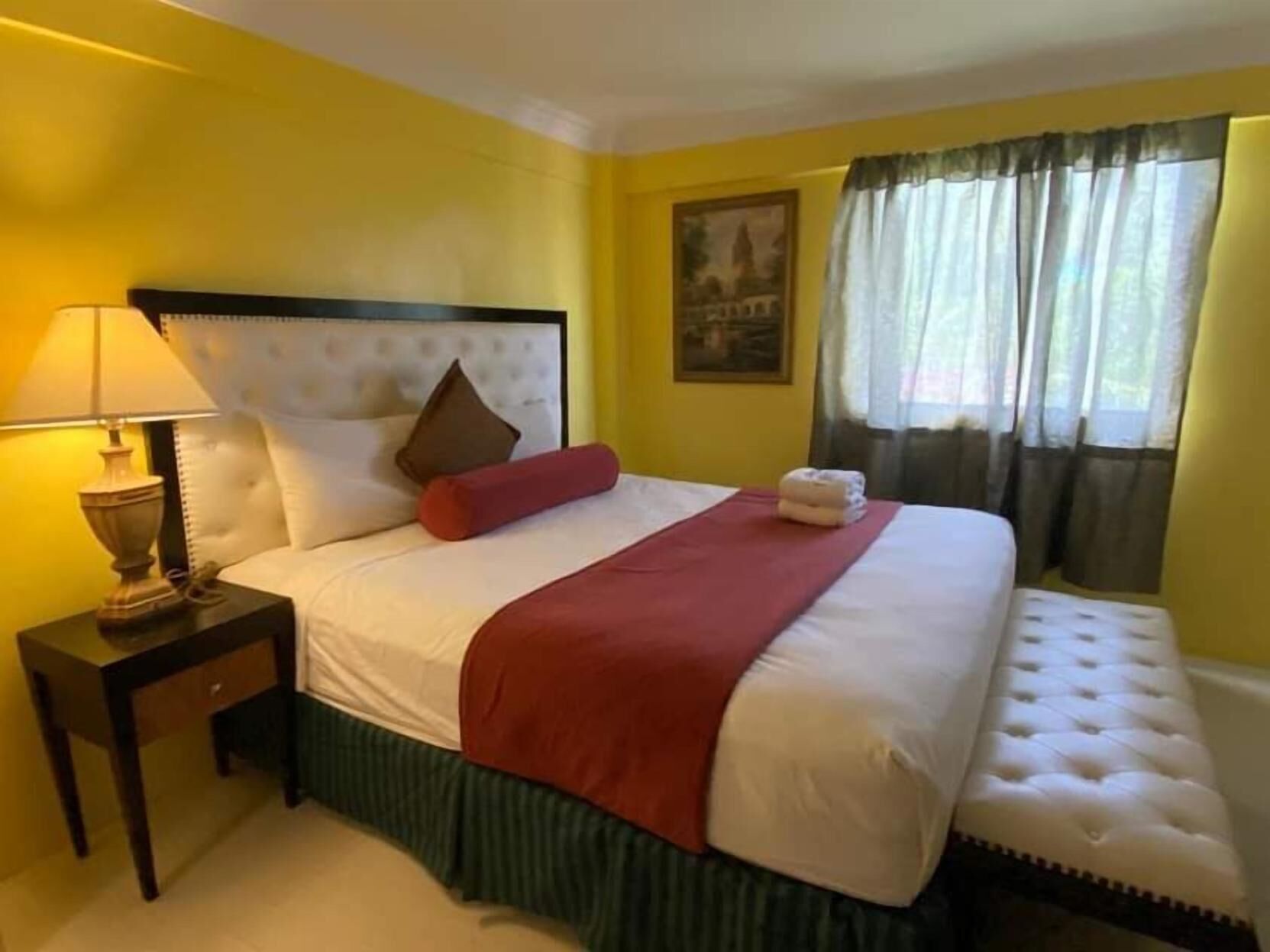 Desk, iron/ironing board, bed sheets