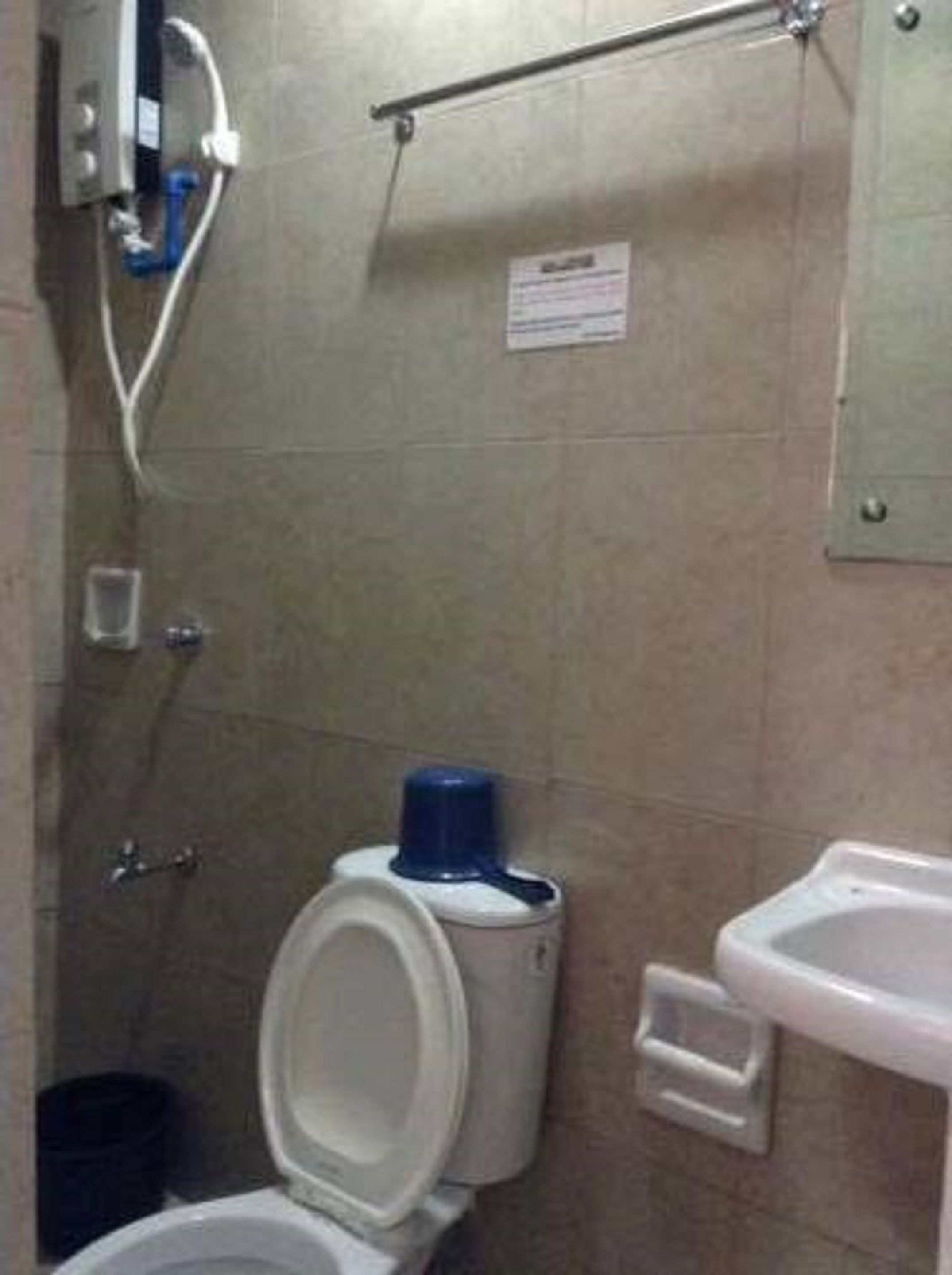 A standard bathroom with a toilet, bidet, and sink.