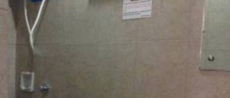 A standard bathroom with a toilet, bidet, and sink.