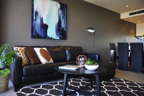Apartment, 2 Bedrooms | Living room | Flat-screen TV