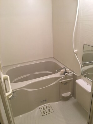 Suite | Bathroom | Deep-soaking bathtub, free toiletries, hair dryer, slippers
