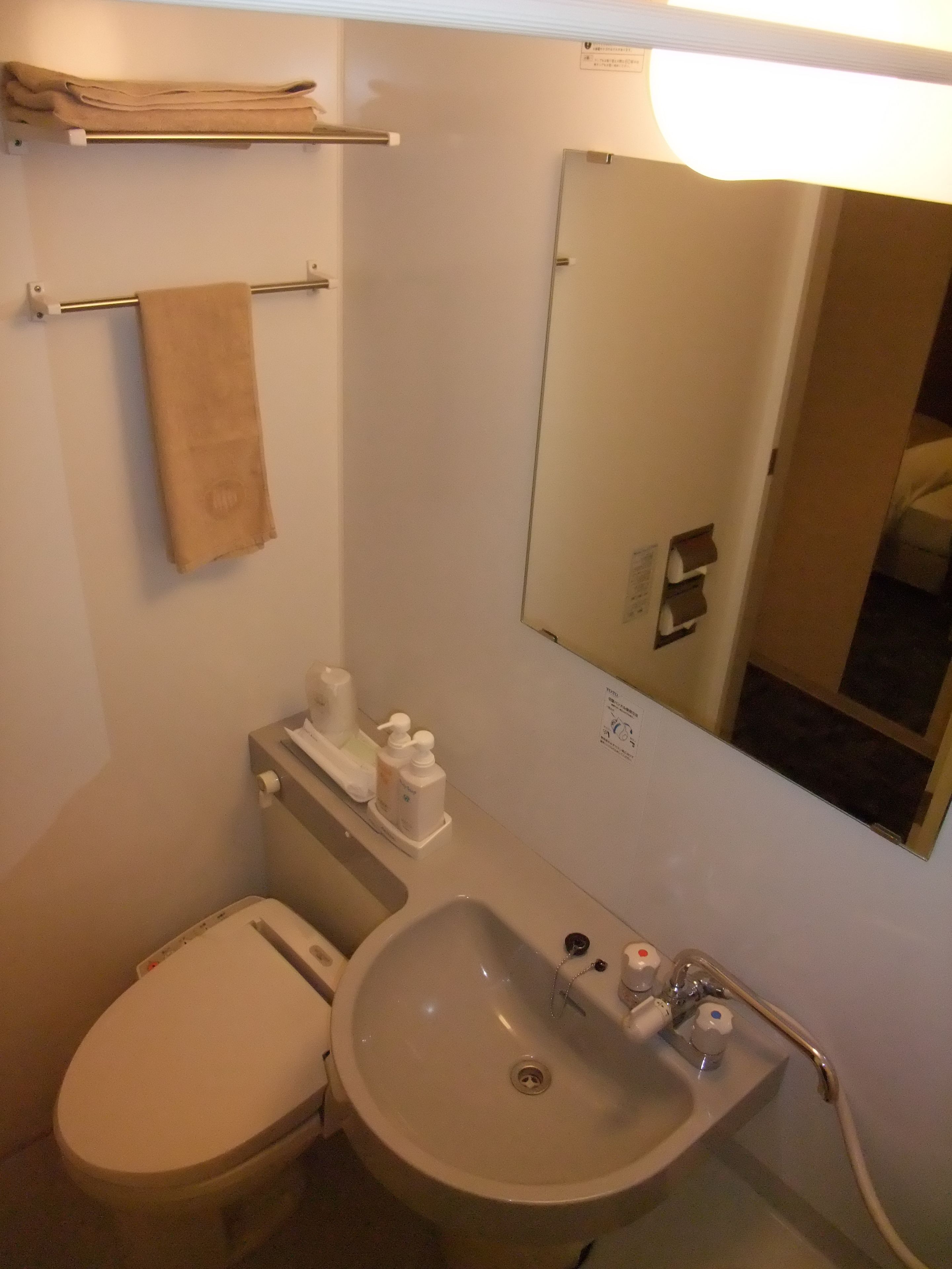 Combined shower/tub, free toiletries, hair dryer, slippers