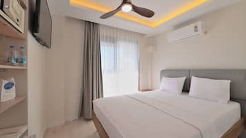 Economy Double Room | Minibar, in-room safe, iron/ironing board, free WiFi