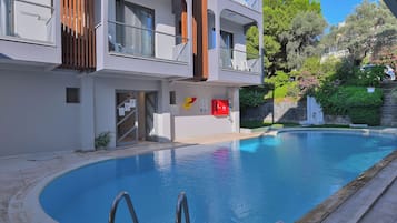 Outdoor pool, pool umbrellas, sun loungers