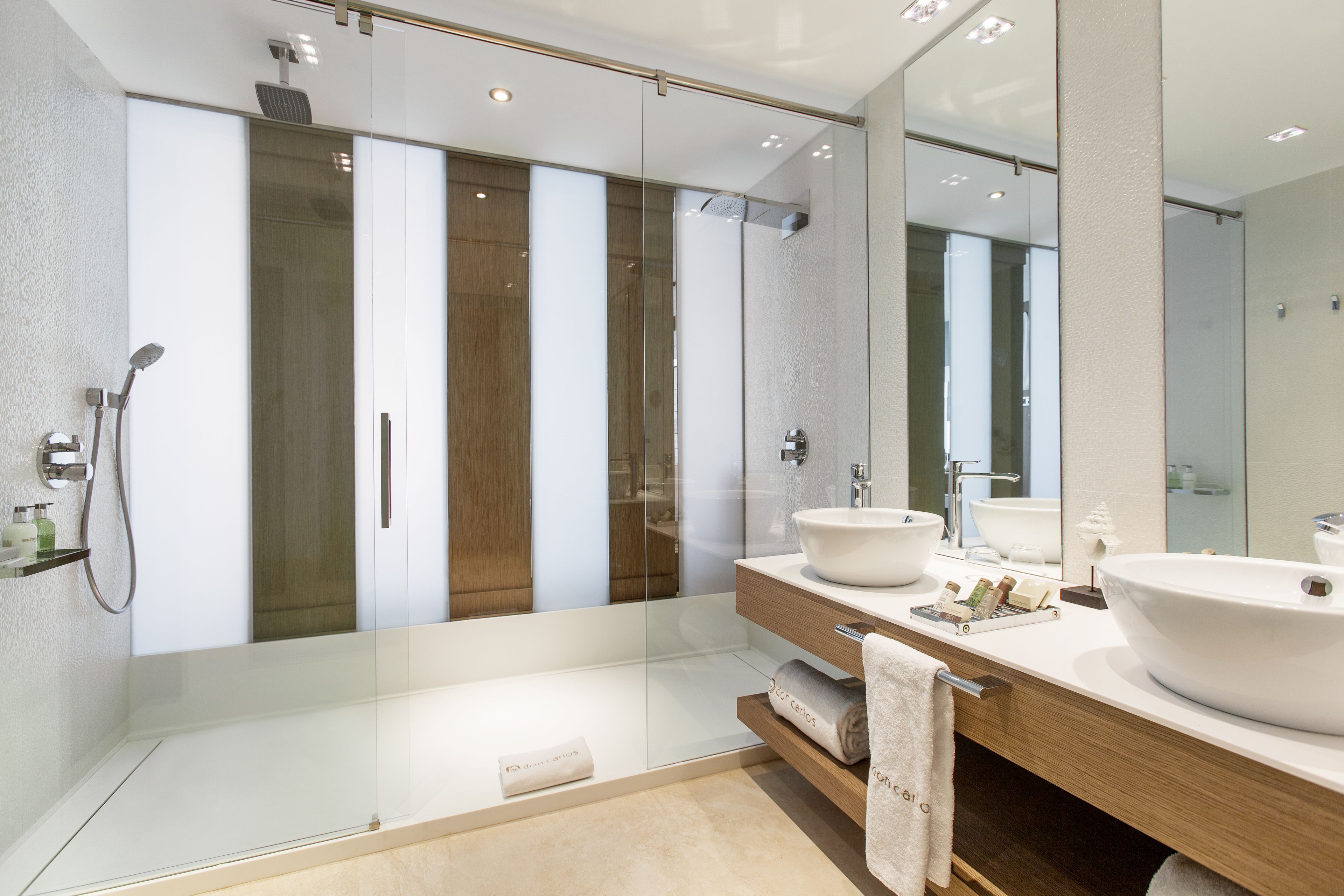 separate bathtub and shower, rainfall showerhead, designer toiletries