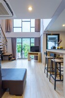 Duplex Suite | Living area | Flat-screen TV, DVD player