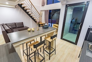 Duplex Suite | Living area | Flat-screen TV, DVD player