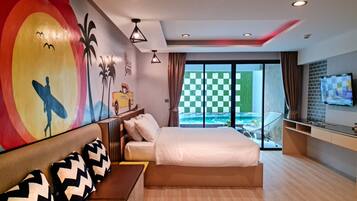 Deluxe Room, Pool Access | Minibar, in-room safe, desk, free cribs/infant beds