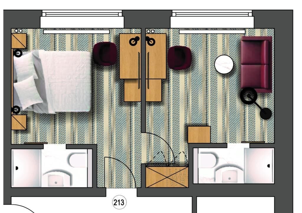 Indeling van een hotelkamer met een bed, twee zithoeken, een bank, een ronde tafel en een bijzettafeltje.
