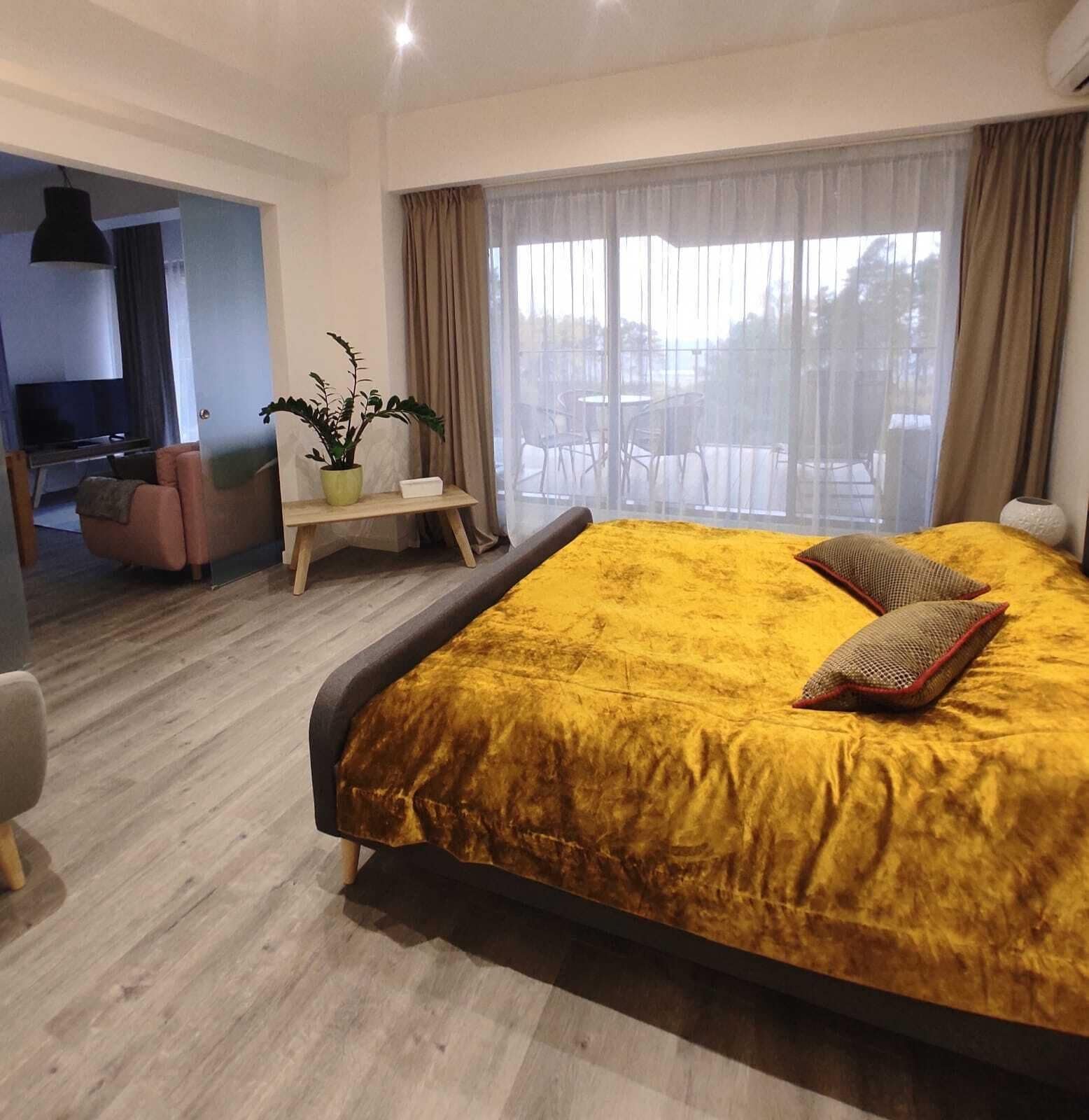 Superior Apartment | Living area | 85-inch Smart TV with digital channels