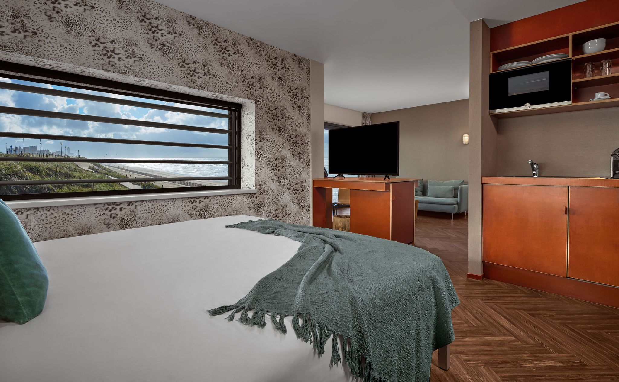 junior suite, 1 double bed, kitchenette, beach view | 1 bedroom, minibar, in-room safe, desk