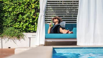 Seasonal outdoor pool, open 9:00 AM to 7:00 PM, pool umbrellas