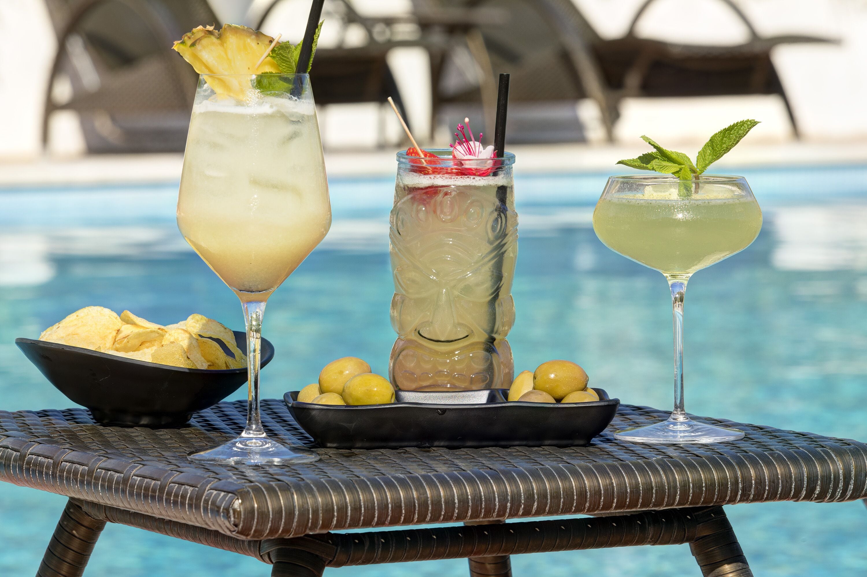 Seasonal outdoor pool, open 9:00 AM to 7:00 PM, pool umbrellas