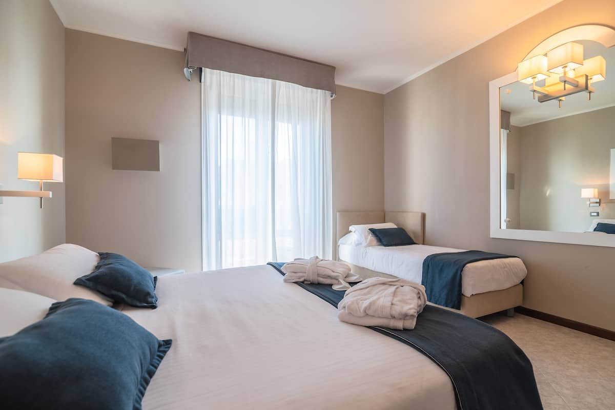 Comfort Triple Room, Partial Sea View (Large) | Minibar, in-room safe, individually decorated, individually furnished