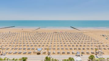 Private beach, white sand, sun loungers, beach umbrellas