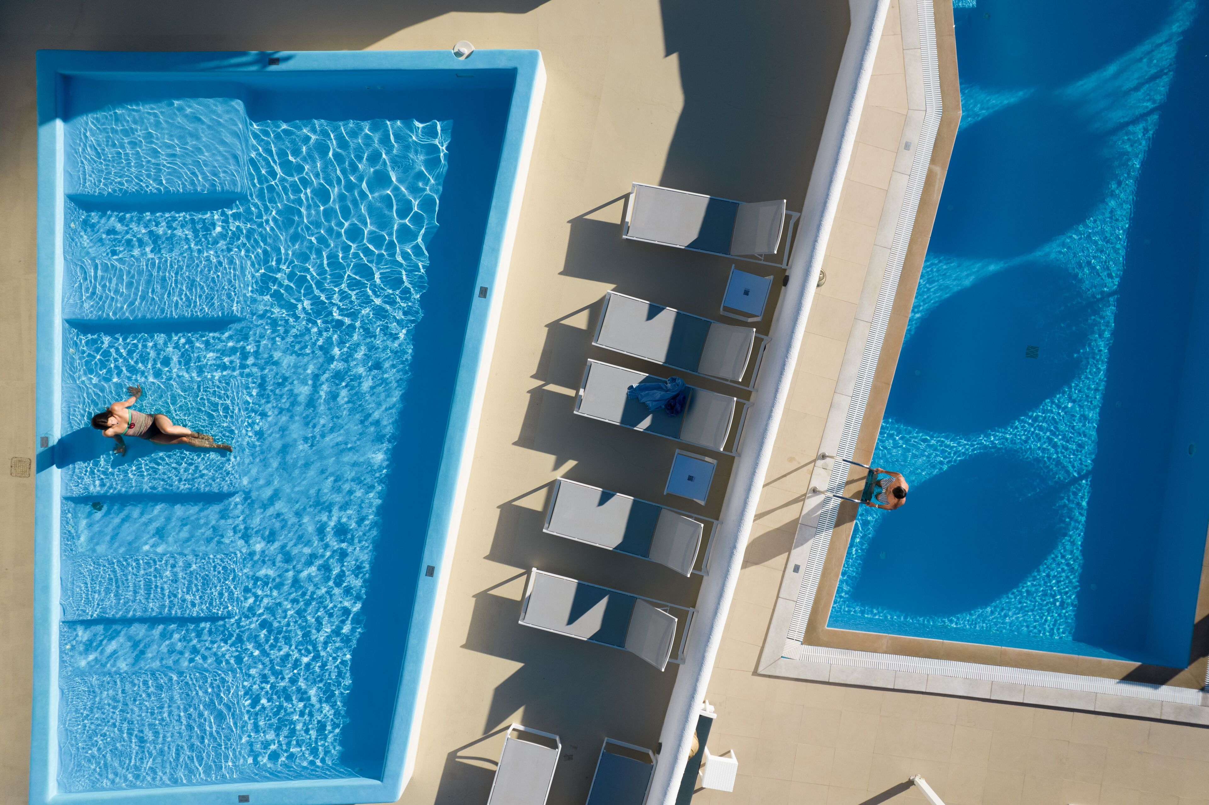 seasonal outdoor pool, pool umbrellas, pool loungers