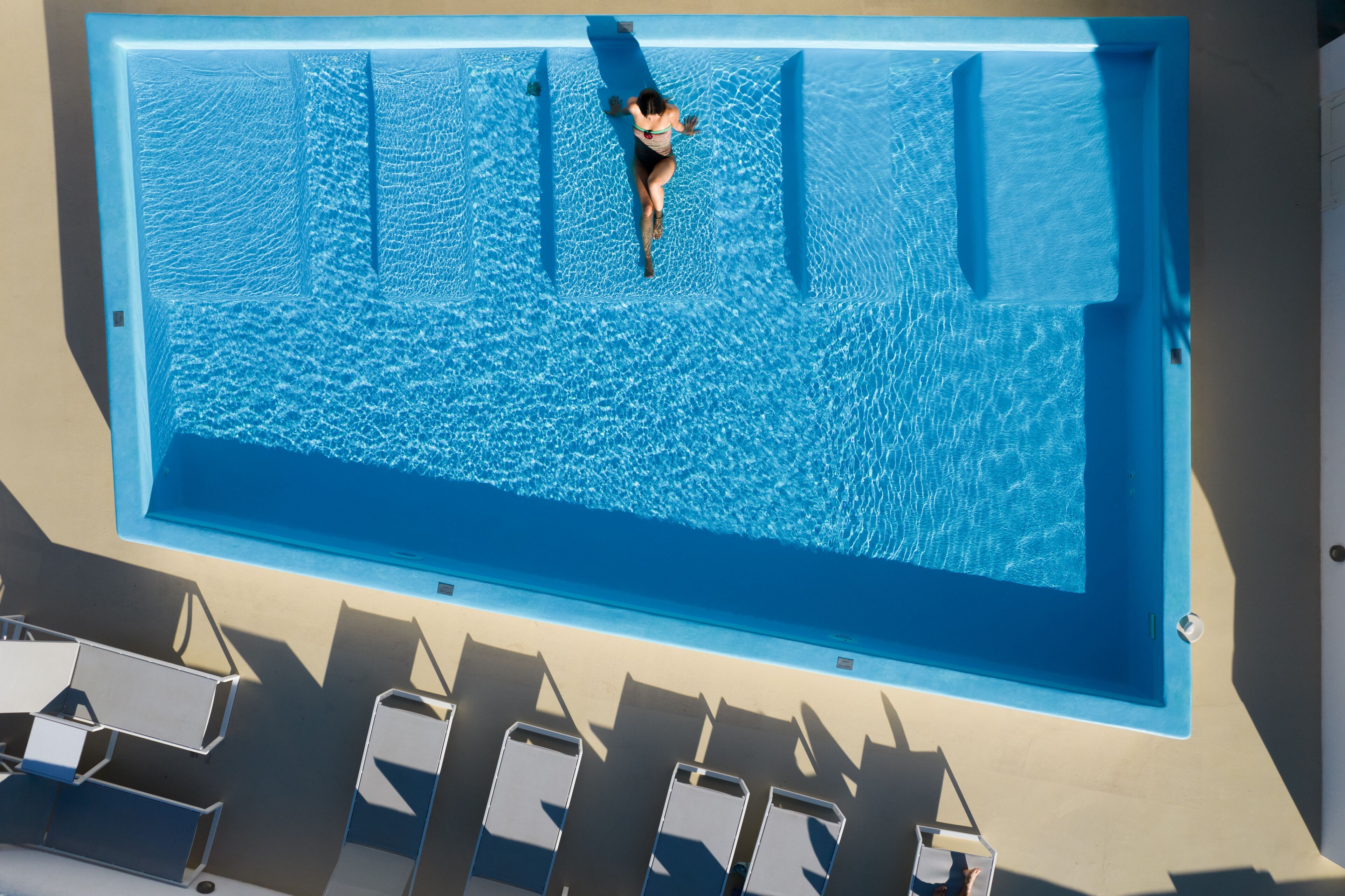 seasonal outdoor pool, pool umbrellas, pool loungers