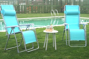 Seasonal outdoor pool, pool umbrellas, pool loungers