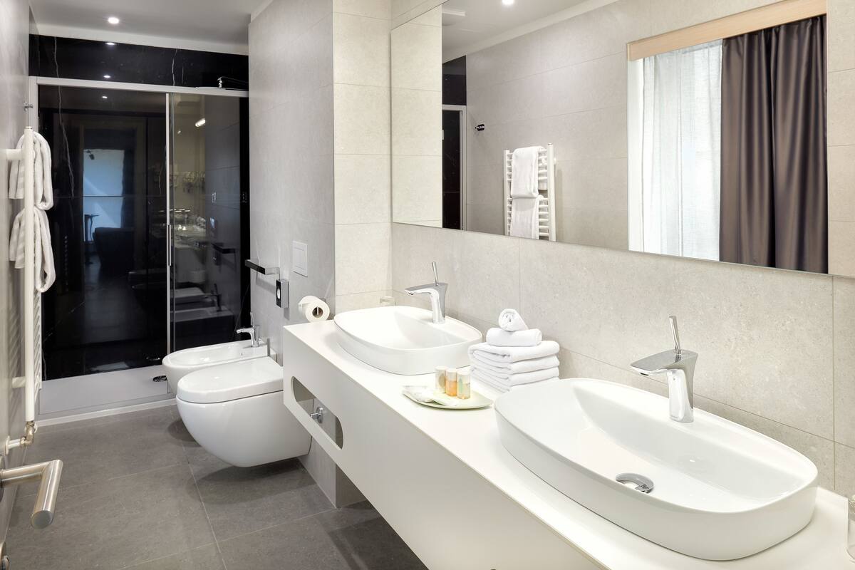 luxury cesar suite | bathroom | free toiletries, hair dryer, bathrobes, slippers