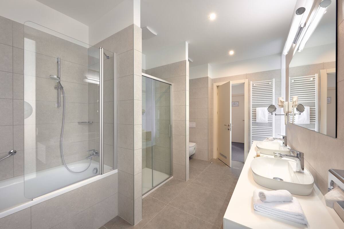 junior luxury suite with balcony  | bathroom | free toiletries, hair dryer, bathrobes, slippers