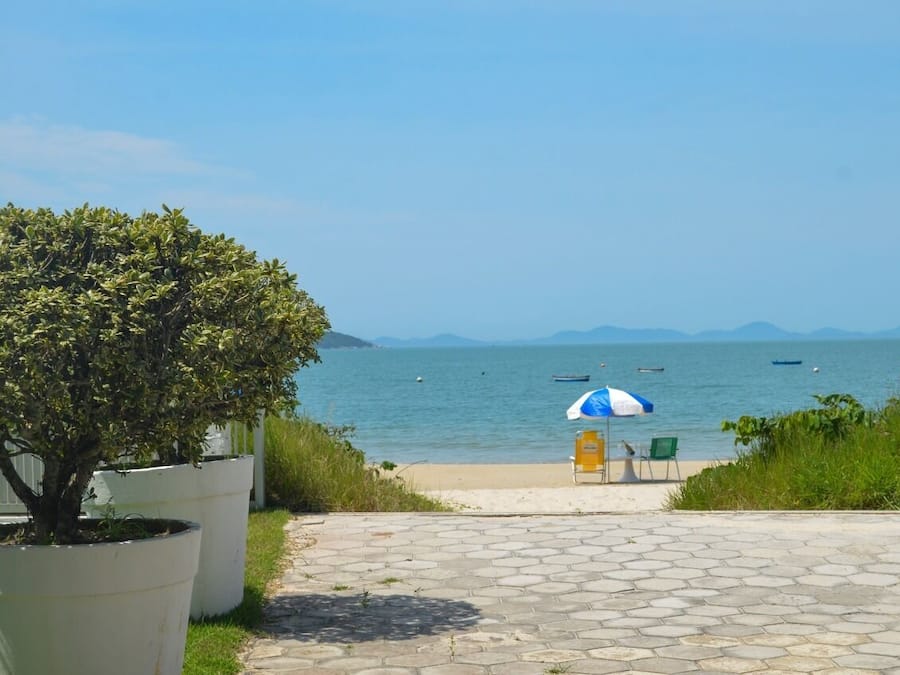 On the beach, white sand, sun loungers, beach umbrellas