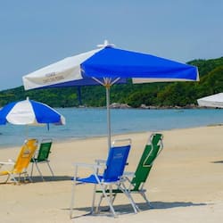 On the beach, white sand, sun loungers, beach umbrellas